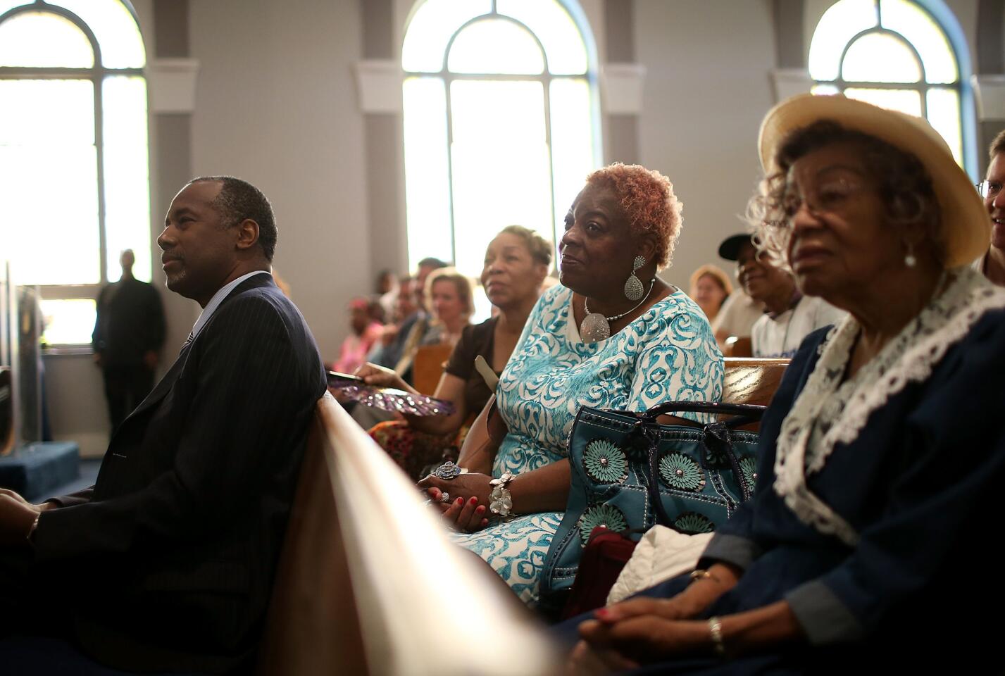 Republican presidential hopeful Ben Carson looks on during church services at Maple Street Missionary Baptist Church in Des Moines , Iowa.