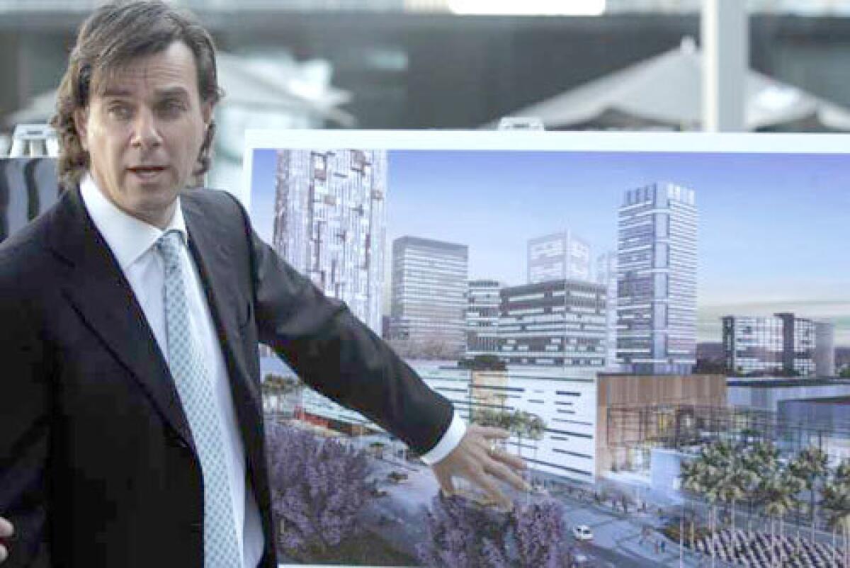 MIXED USE: Peter Lowy, head of Westfield America, shows an artists rendering of what the Century City shopping center will look like. The center will offer retail, residential and office space.