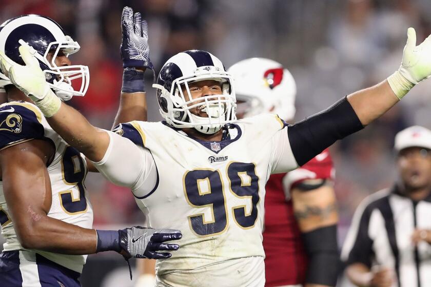 GLENDALE, AZ - DECEMBER 03: Defensive end Aaron Donald #99 of the Los Angeles Rams reacts after a tackle during the second half of the NFL game against the Arizona Cardinals at the University of Phoenix Stadium on December 3, 2017 in Glendale, Arizona. (Photo by Christian Petersen/Getty Images) ** OUTS - ELSENT, FPG, CM - OUTS * NM, PH, VA if sourced by CT, LA or MoD ** ** OUTS - ELSENT, FPG, CM - OUTS * NM, PH, VA if sourced by CT, LA or MoD **