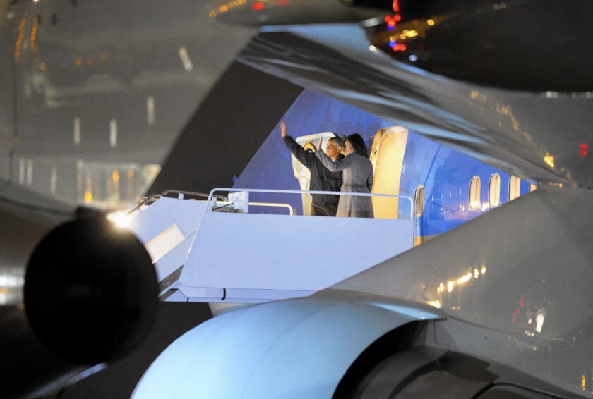 President Obama and First Lady Michelle Obama board Air Force One at Andrews Air Force Base in Maryland for their trip to India. They will also visit Saudi Arabia to pay respects to the late King Abdullah and his family.