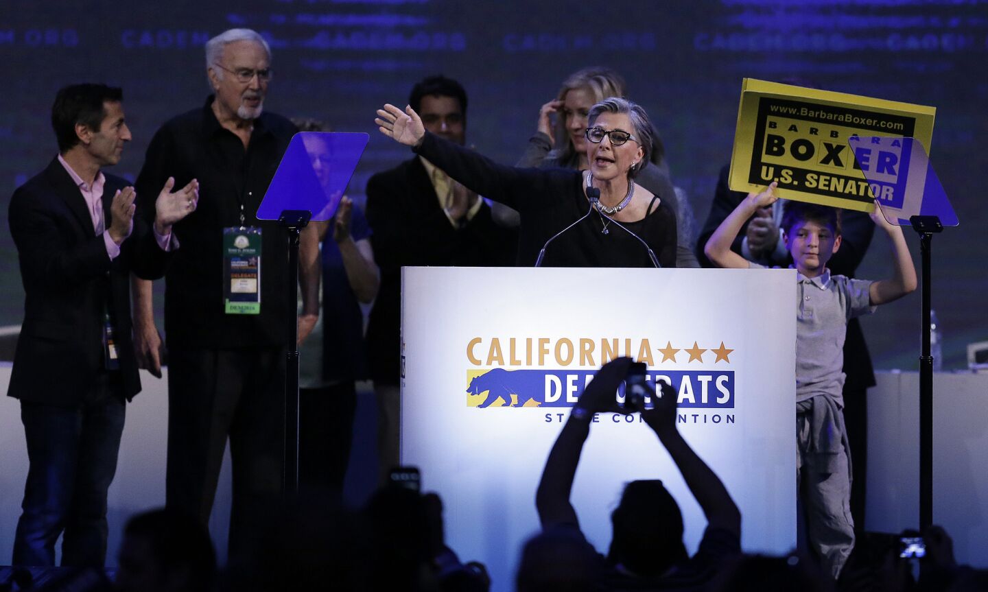 U.S. Sen. Barbara Boxer, D-Calif, center, waves after speaking before the California Democratic Party Convention on Saturday in San Jose.