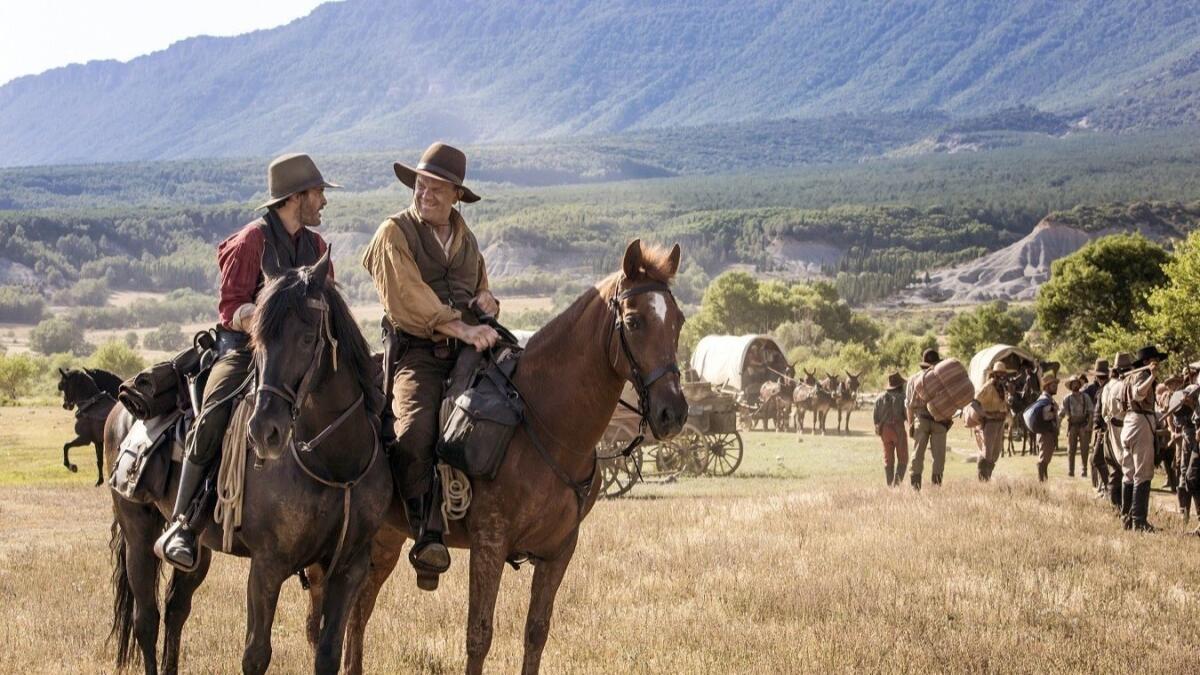 Joaquin Phoenix, left, and John C. Reilly in a scene from "The Sisters Brothers."