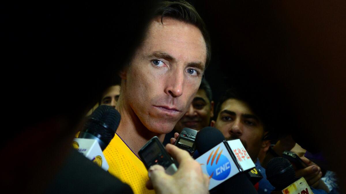 Lakers guard Steve Nash looks on while listening to questions from reporters during the team's media day on Monday.