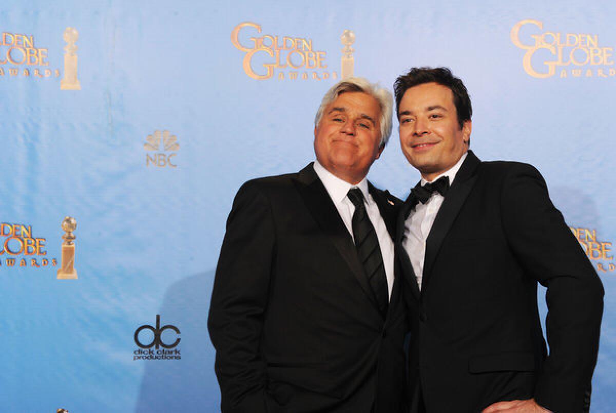 Presenters Jay Leno, left, and Jimmy Fallon pose in the press room during the 70th Annual Golden Globe Awards at the Beverly Hilton Hotel in Beverly Hills.