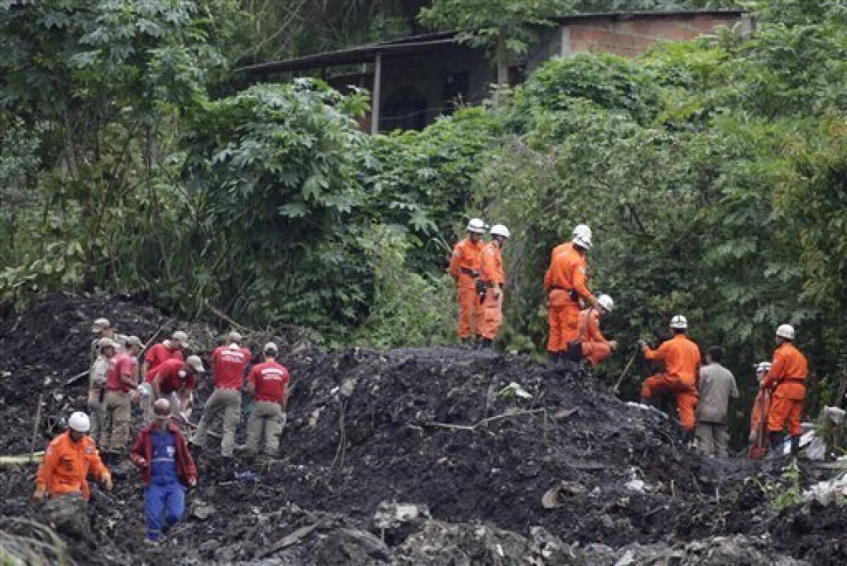 Firefighters search for people buried by a landslide in the Morro do Bumba area of the Niteroi neighborhood in Rio de Janeiro, Thursday, April 8, 2010. At least 200 people were buried and feared dead under the latest landslide to hit a slum in Rio de Janeiro's metropolitan area, authorities said Thursday. (AP Photo/Felipe Dana)