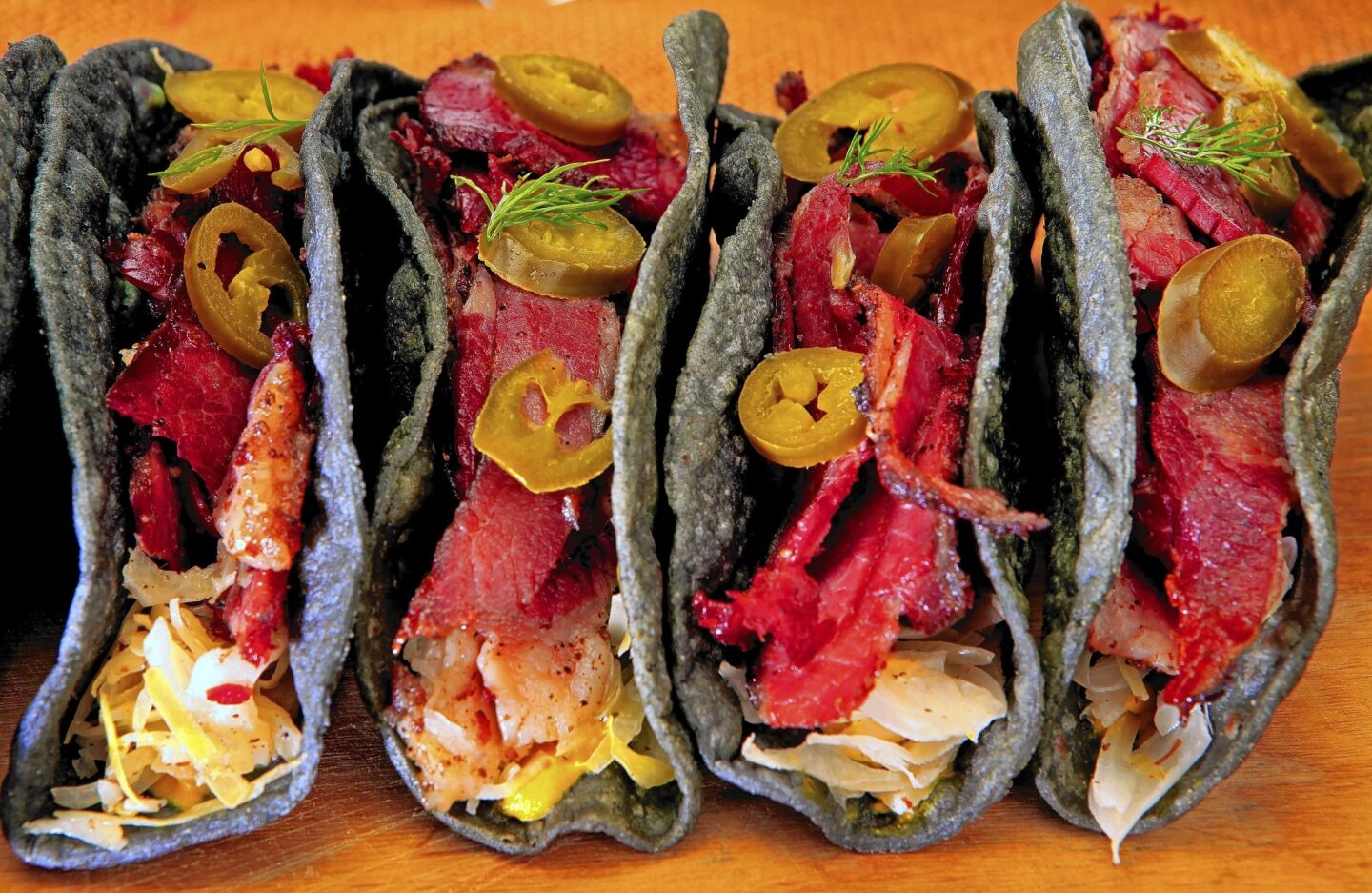 Pastrami tacos made with blue-corn tortillas.