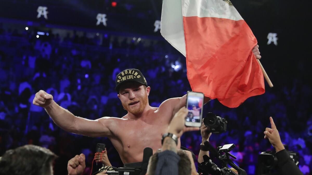 Canelo Alvarez celebrates after defeating Gennady Golovkin by majority decision in a middleweight title boxing match on Sept. 15 in Las Vegas.