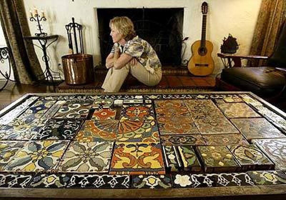 Tile expert Cristi Walden has a coffee table in her home custom made to display an assortment of tiles from Malibu Potteries. She laments that people dont take the time to salvage old tile, "and this truly important part of our heritage is lost."