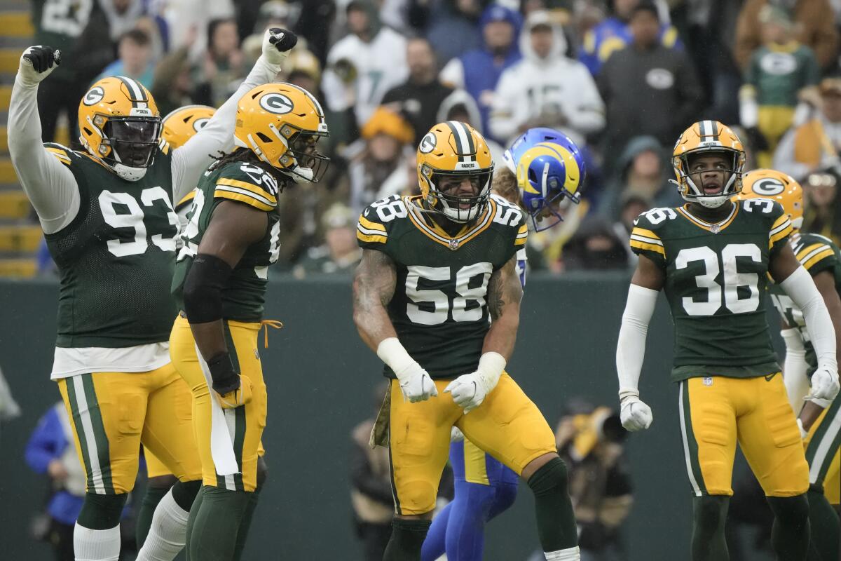 Green Bay Packers linebacker Isaiah McDuffie (58) celebrates after a stop on third down against the Rams in the second half.