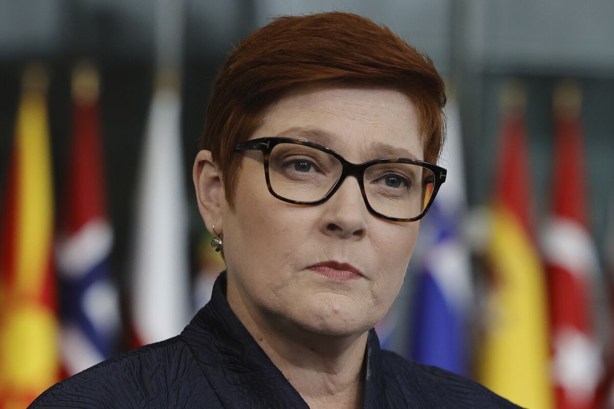 FILE - Australian Foreign Minister Marise Payne speaks with the media as she arrives for a meeting of NATO foreign ministers at NATO headquarters in Brussels on April 7, 2022. Payne said on Saturday, May 7, 2022 she met the Solomon Islands' Development Planning and Aid Coordination Minister Jeremiah Manele in the Australian east coast city of Brisbane as he transited through the airport on Friday night. (AP Photo/Olivier Matthys, File)