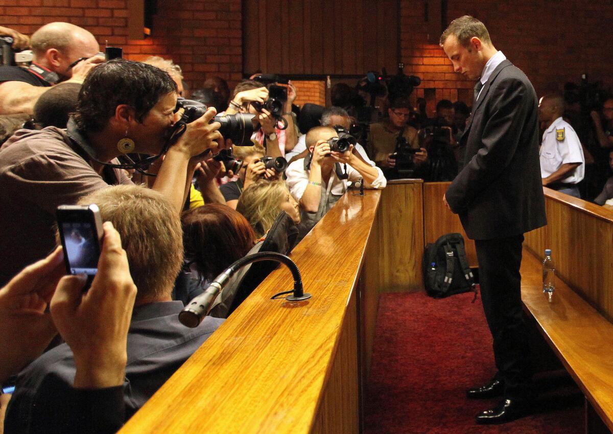 South African Olympic athlete Oscar Pistorius stands in court during a bail hearing in Pretoria last year.