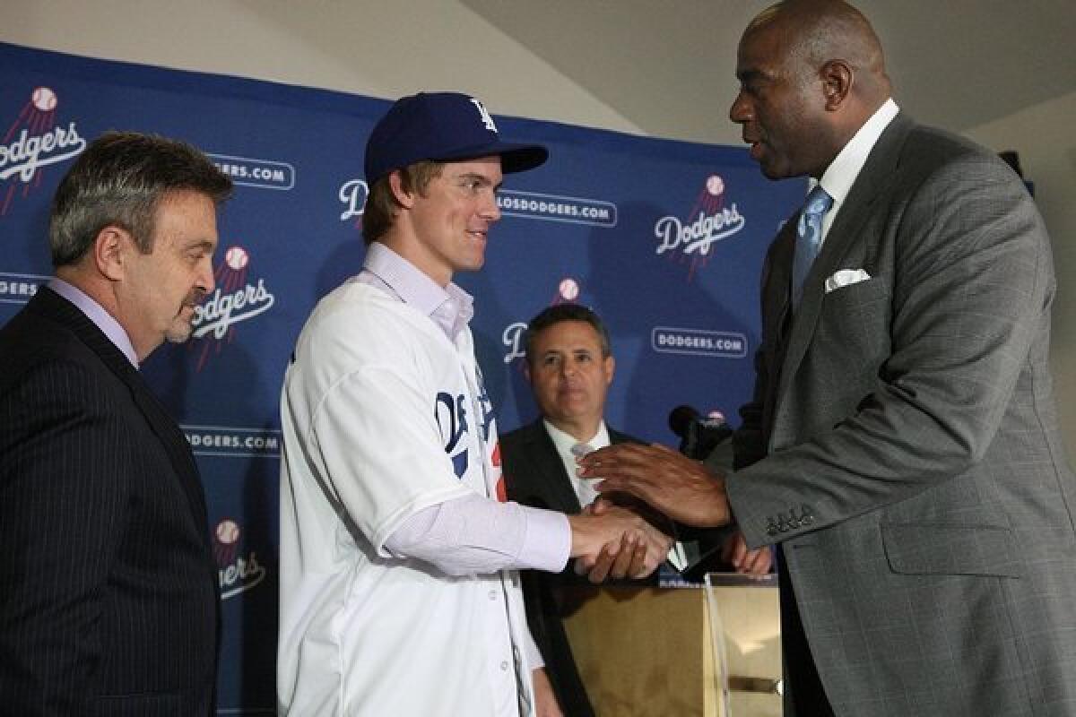Dodgers co-owner Magic Johnson, right, with new team acquisition Zack Greinke.
