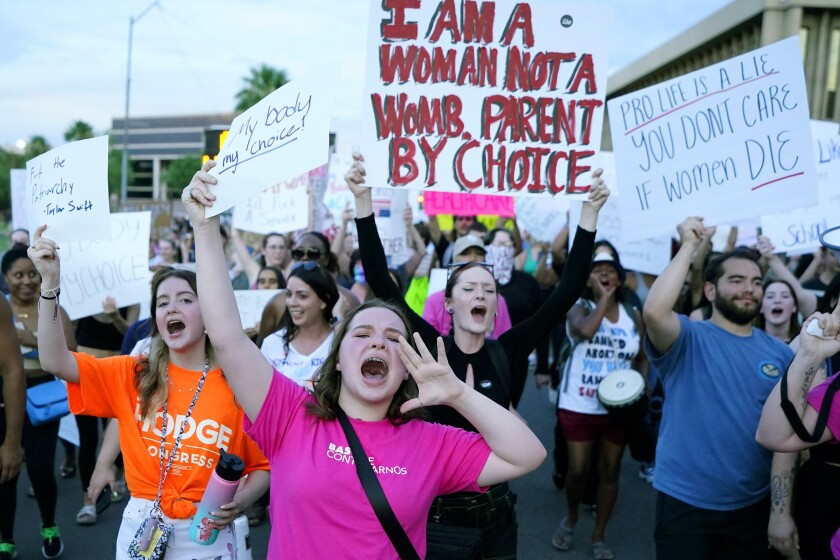 Protesters march at the Arizona Capitol  on Friday in Phoenix after the Supreme Court decision to overturn Roe v. Wade.
