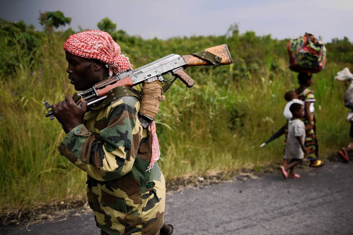 An M23 rebel marches toward the town of Sake, west of Goma, in November.