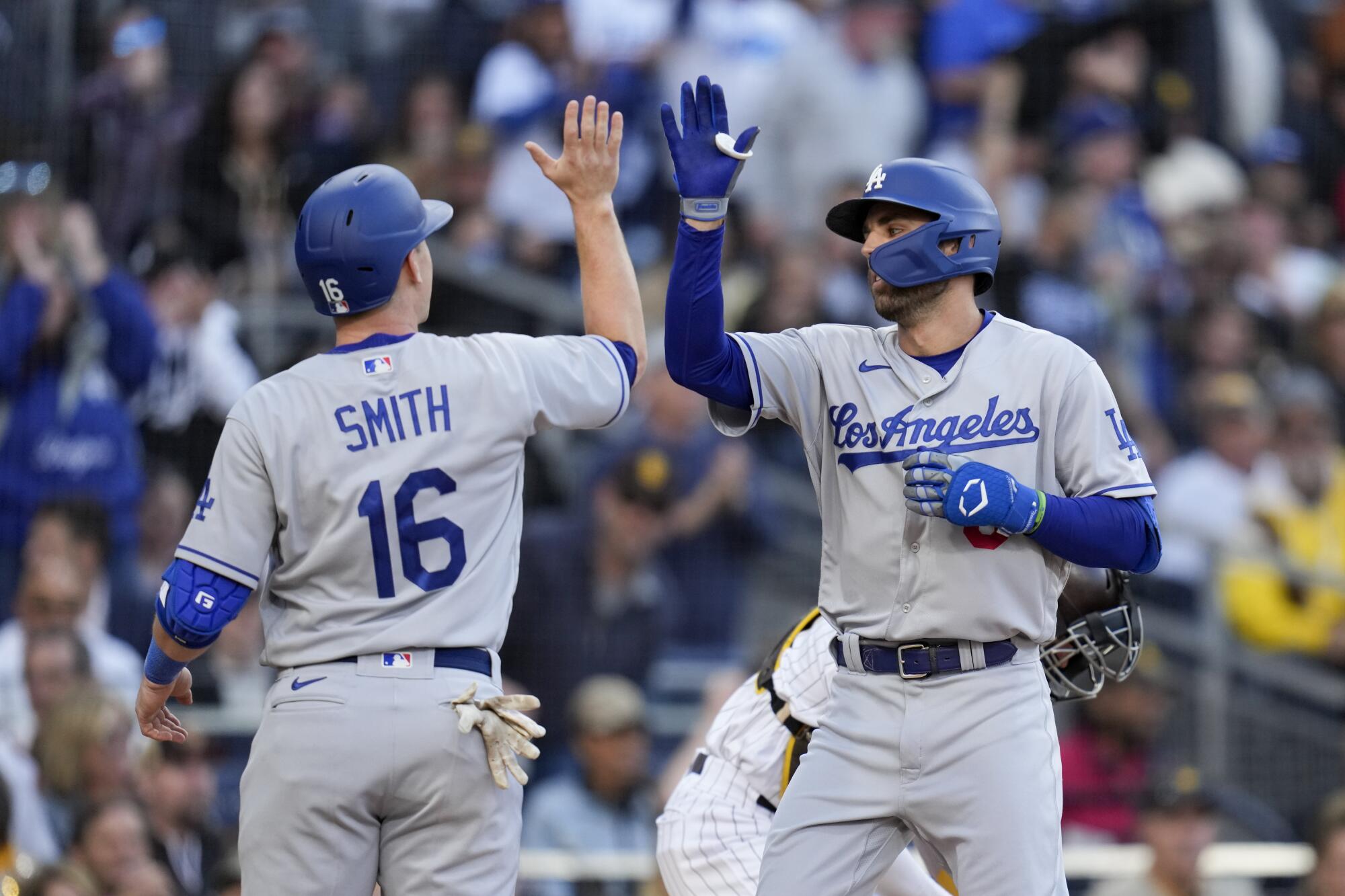 The Dodgers' Chris Taylor, right, celebrates with Will Smith after Taylor hit a two-run home run May 6, 2023, at San Diego.