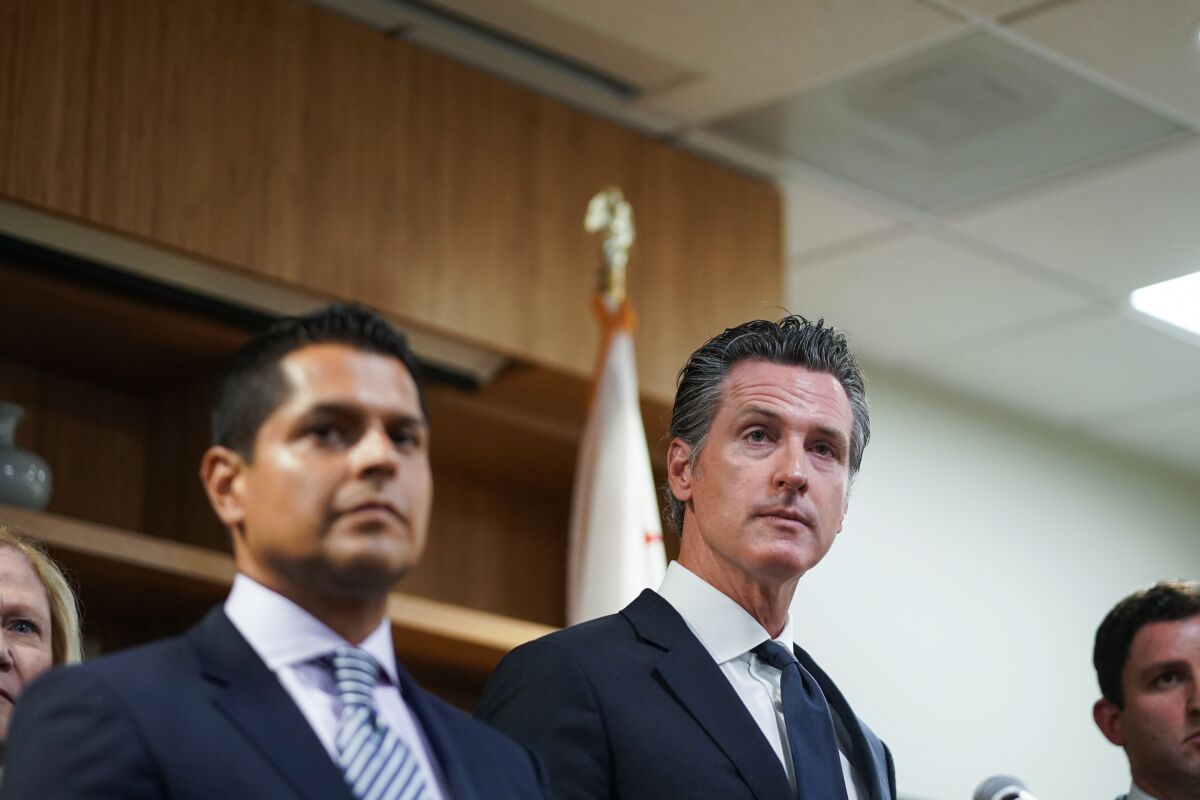 Gov. Gavin Newsom takes questions during a press conference at Public Counsel, on Wednesday in Los Angeles