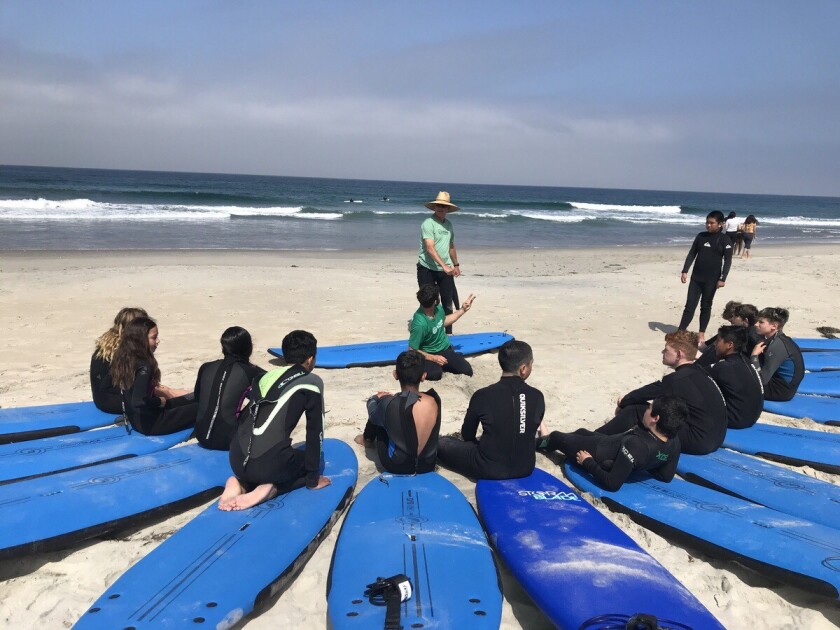 Middle School students from Escondido Union School District took a surf lesson as part of a GATE summer camp focused on the Escondido Creek watershed.