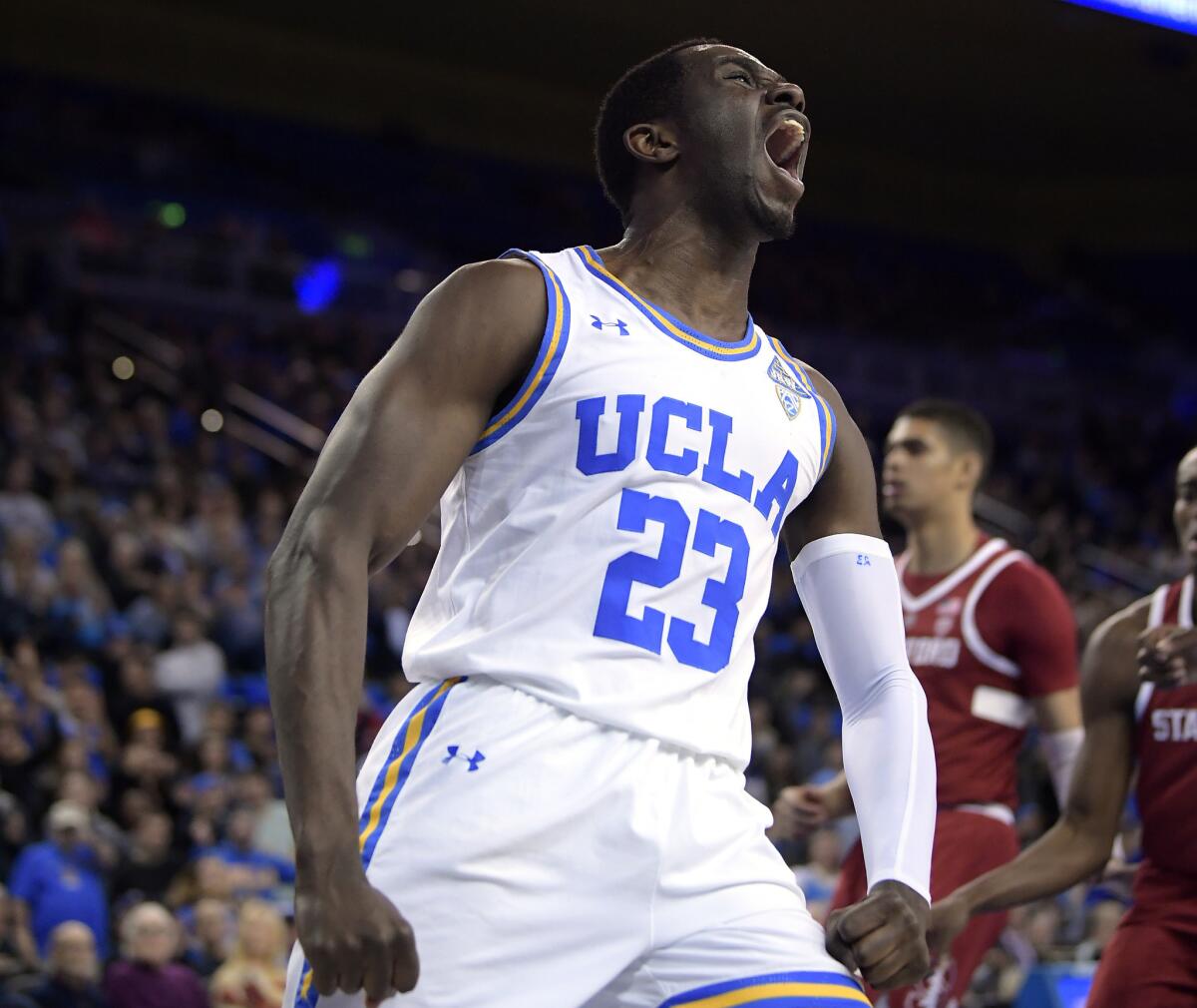 UCLA guard Prince Ali celebrates after a dunk during a game against Stanford last season.