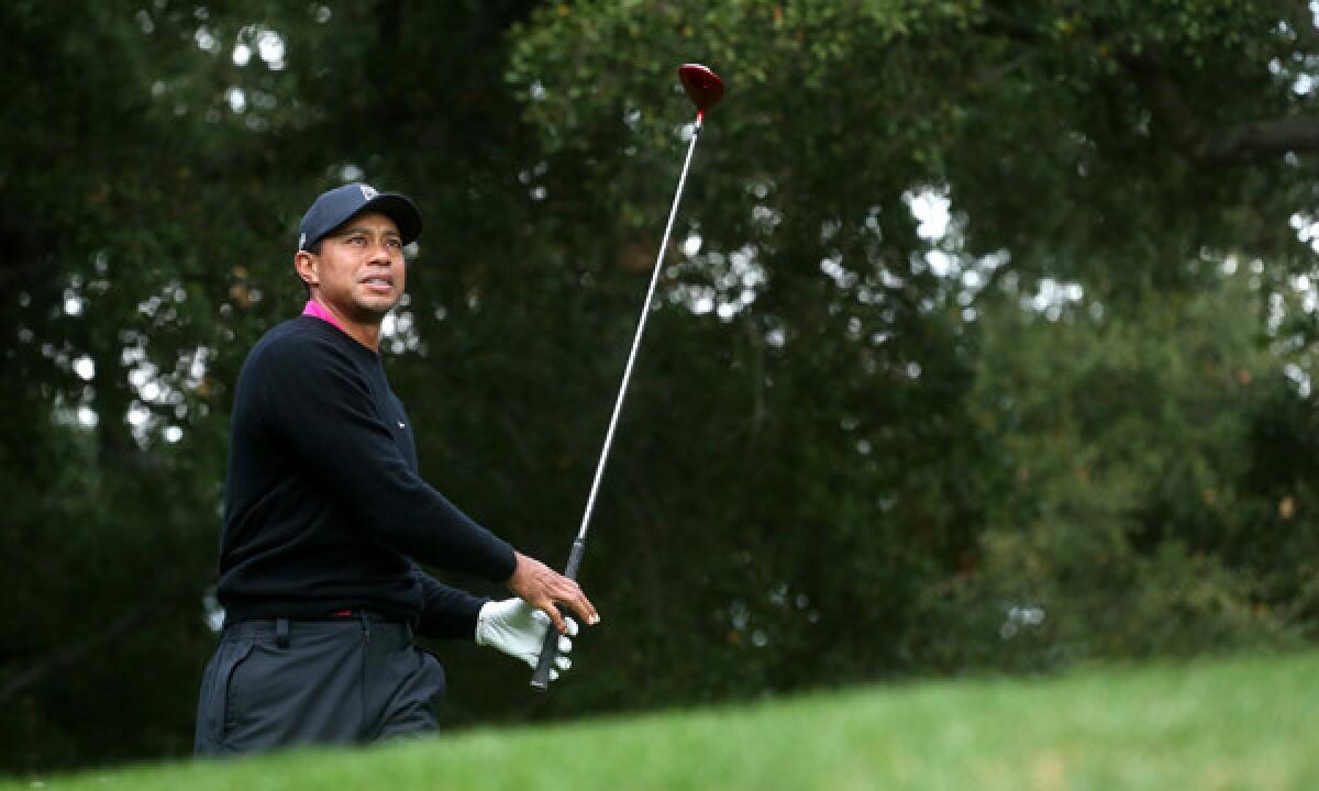 Tiger Woods watches his tee shot on the sixth hole during the third round of the Northwestern Mutual World Challenge at Sherwood Country Club in Thousand Oaks on Saturday.