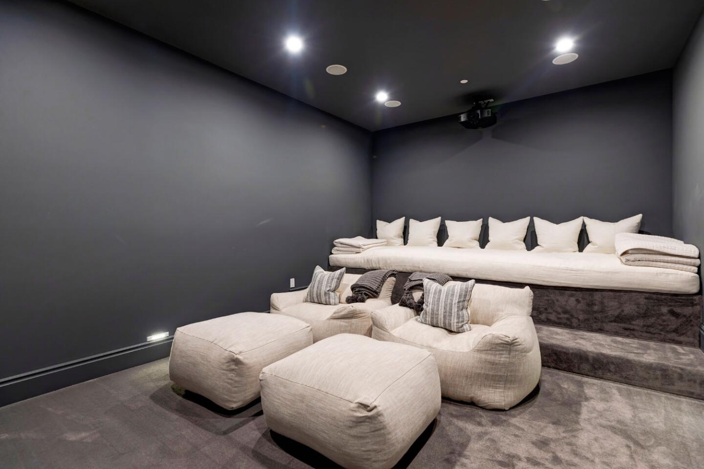 The home theater features tiered seating.