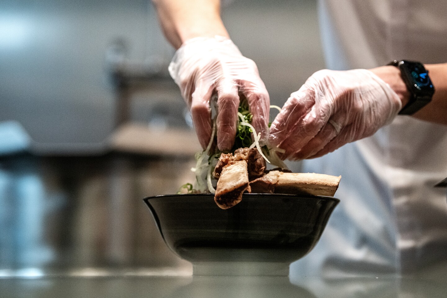 IRVINE, CA - FEBRUARY 09: Inside the kitchen of Sup Noodle Bar where owner, chef Viet Nguyen, demonstrates the process of making his Rib bone pho on Tuesday, Feb. 9, 2021 in Irvine, CA. (Mariah Tauger / Los Angeles Times)