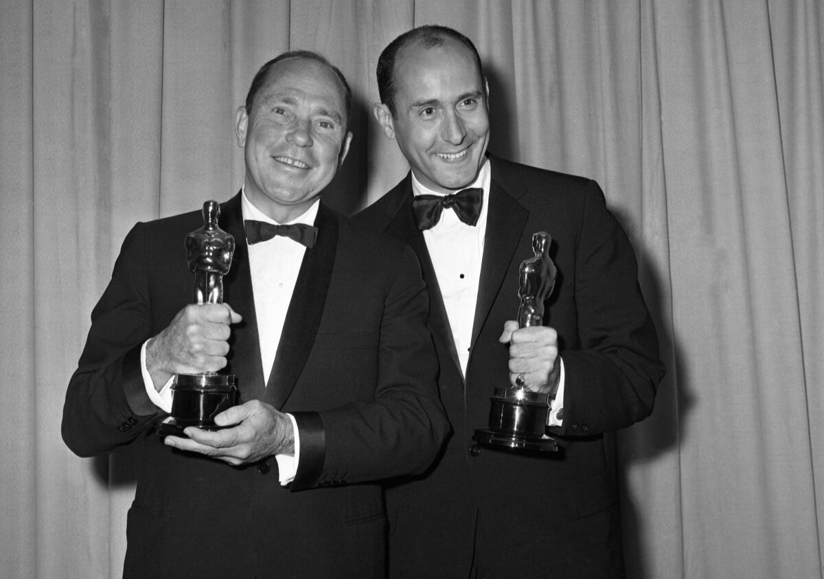  Johnny Mercer, left, and Henry Manciniwith their Oscars for Best Song in a Motion Picture, "The Days of Wine and Roses"  