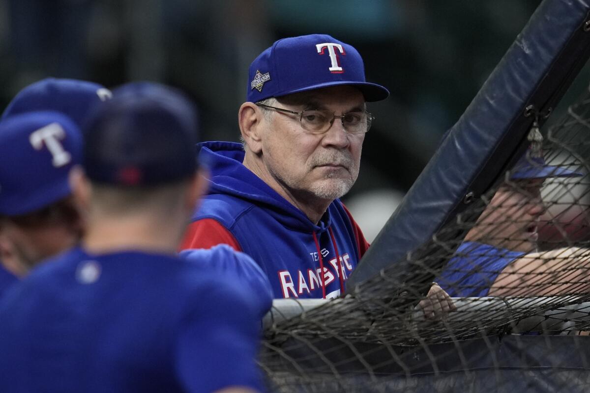 Texas Rangers manager Bruce Bochy watches batting practice.