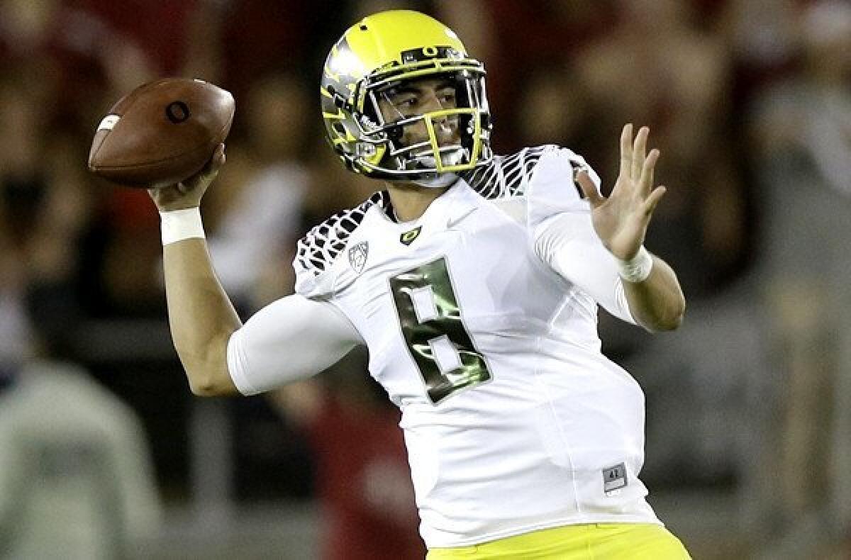Oregon quarterback Marcus Mariota, shown against Stanford, had his threw his first pass intercepted of the season on Saturday.
