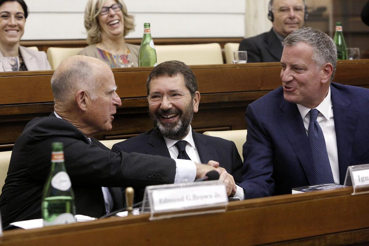 Gov. Jerry Brown, left, Rome Mayor Ignazio Marino, center, and New York Mayor Bill De Blasio during a conference on climate change and modern slavery at the Vatican on Wednesday.