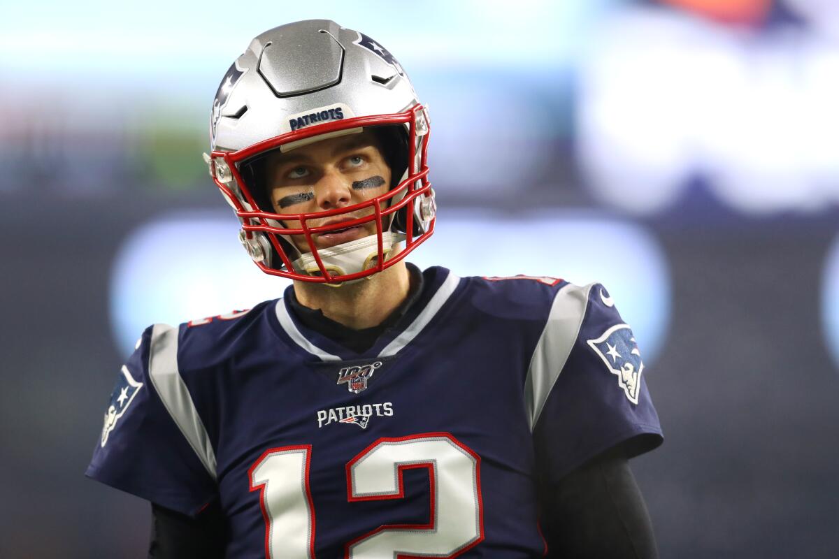 Patriots quarterback Tom Brady looks on during a playoff game against the Titans.