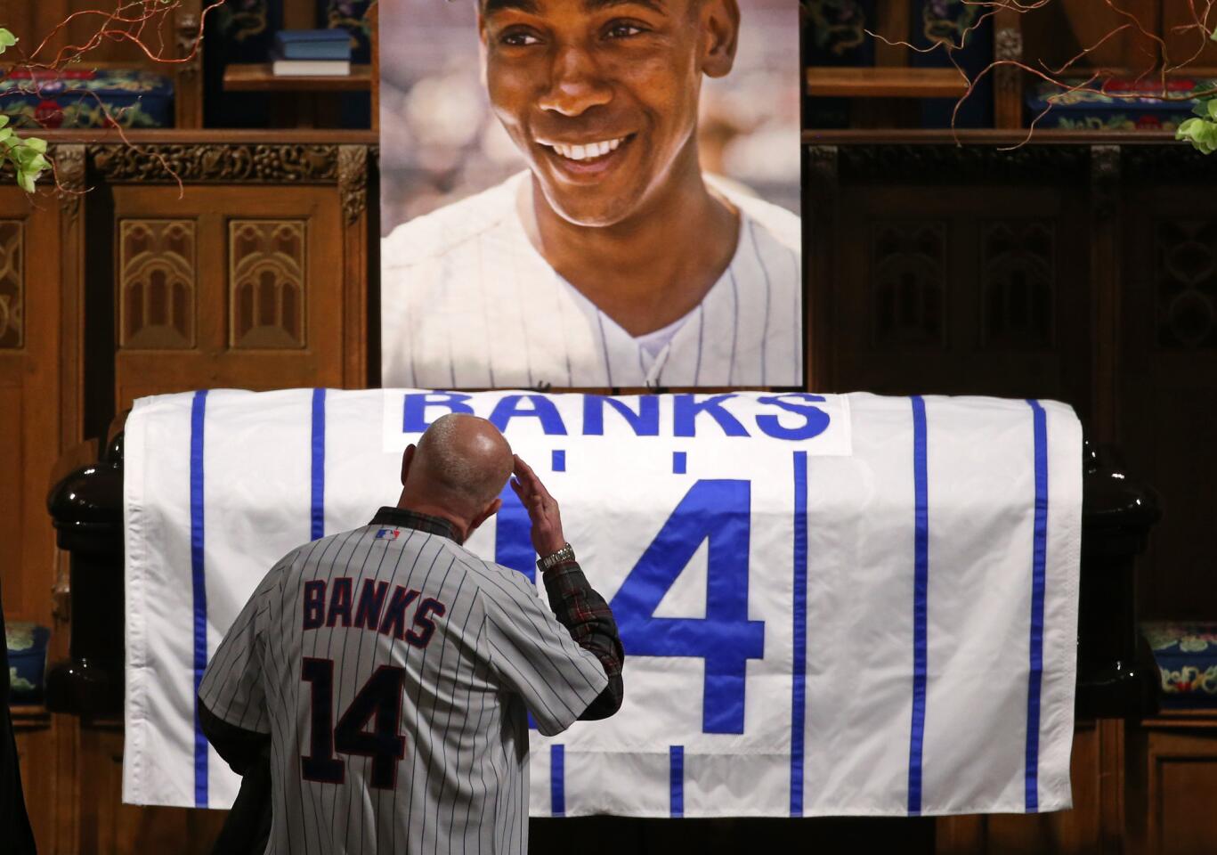Dick Martin, 60, of Grayslake salutes the casket and portrait of Ernie Banks during his visitation at the Fourth Presbyterian Church. "He was my idol, he was my hero," Martin said.