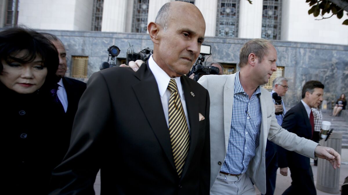 Former Los Angeles County Sheriff Lee Baca leaves the federal courthouse in Los Angeles on Feb. 10.