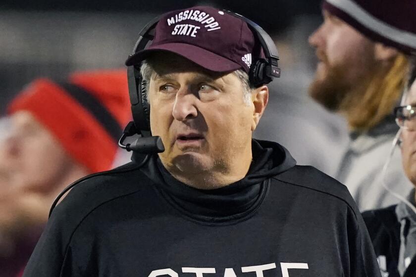 Mississippi State head coach Mike Leach looks across the field at his team during the second half.