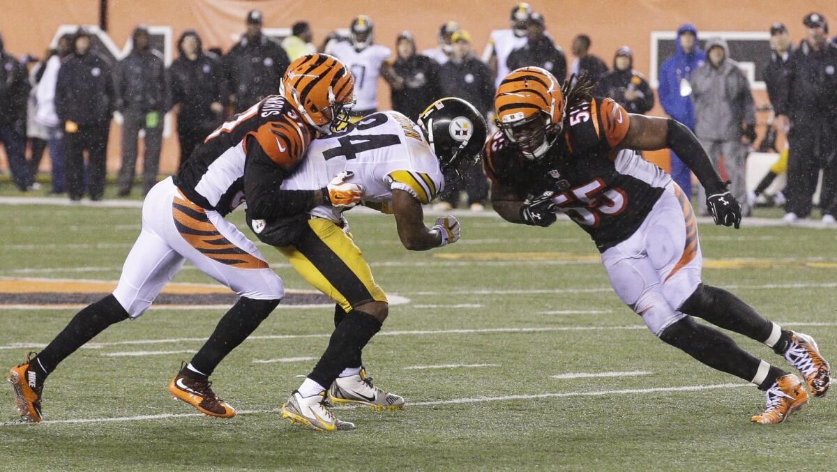 Pittsburgh receiver Antonio Brown suffered a concussion from this hit by Cincinnati's Vontaze Burfict, right, in a Jan. 9 playoff game.