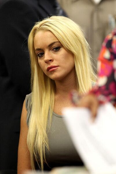Actress Lindsay Lohan surrenders at the Beverly Hills Courthouse to serve her 90 day jail sentence on July 20, 2010 in Beverly Hills, California.