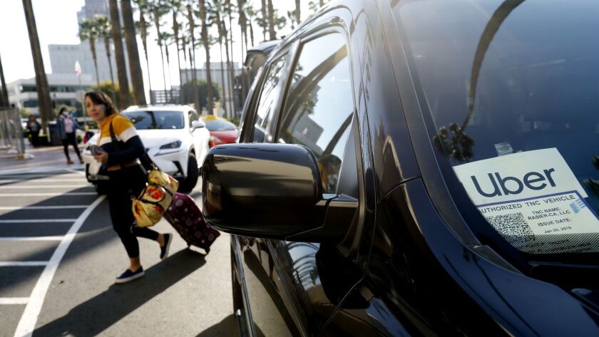 Kristine Valenzuela exits a Uber at Union Station in Los Angeles.