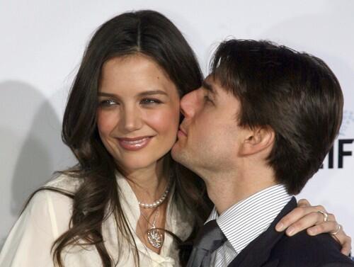 Actor Tom Cruise kisses his wife actress