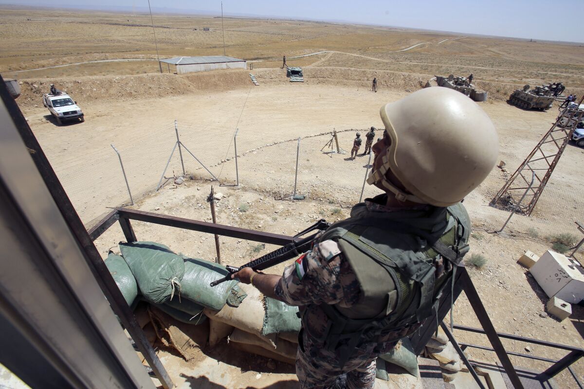 A Jordanian soldier in a guard tower
