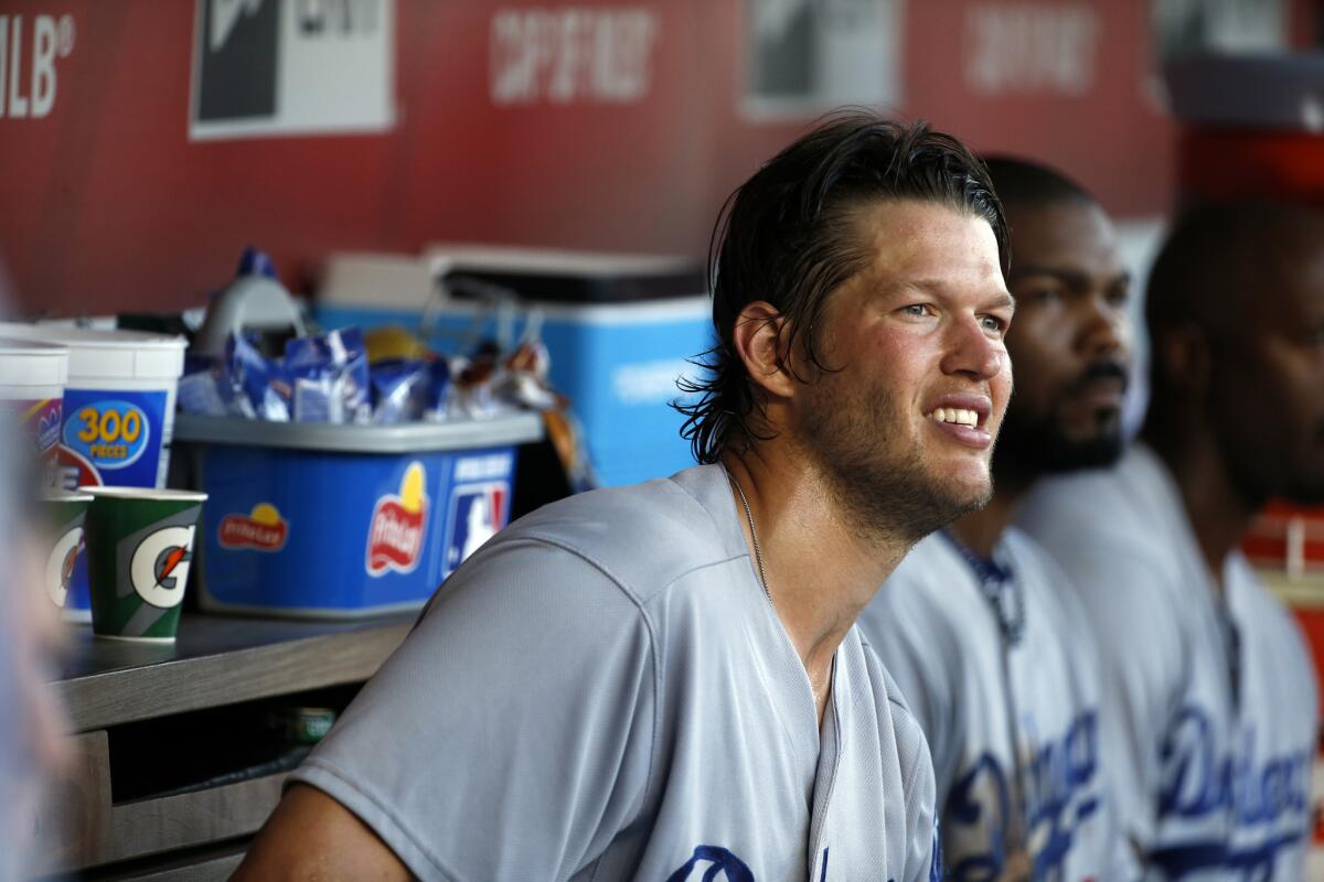 Dodgers pitcher Clayton Kershaw pauses in the dugout during a game against the Washington Nationals on July 18.