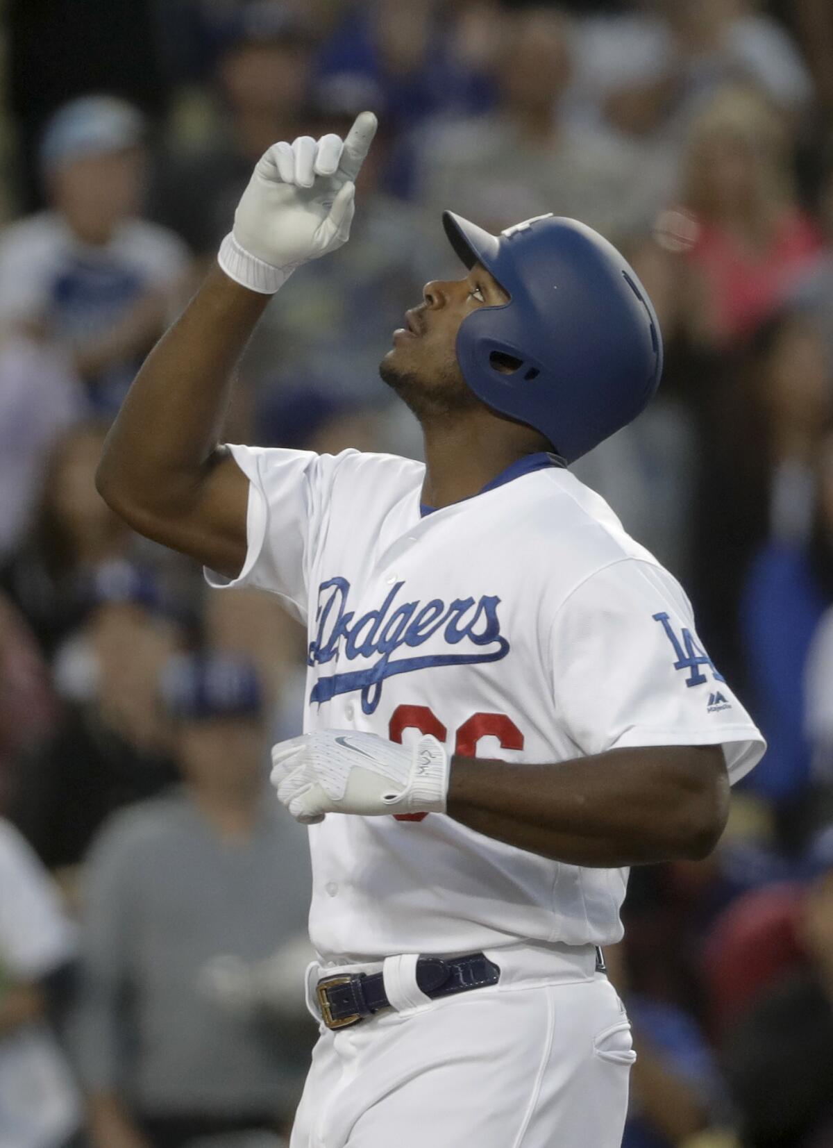 Los Angeles Dodgers' Yasiel Puig celebrates after his two-run home run against the Miami Marlins during the second inning of a baseball game in Los Angeles, Thursday, May 18, 2017. (AP Photo/Chris Carlson)