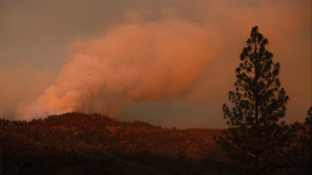 The Ferguson fire burns in unincorporated Mariposa County, where a forecast of thunderstorms posed possible new dangers for firefighters Wednesday.