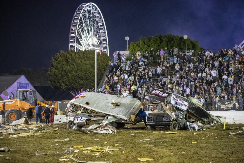 Destroyed motorhomes lie wrecked following the Motorhome Madness demolition derby.