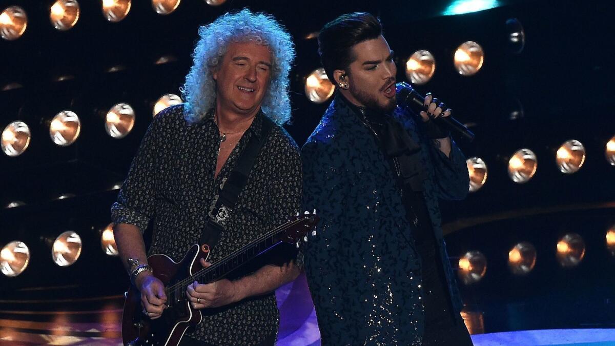 Queen guitarist Brian May, left, and singer Adam Lambert perform at the Oscars.
