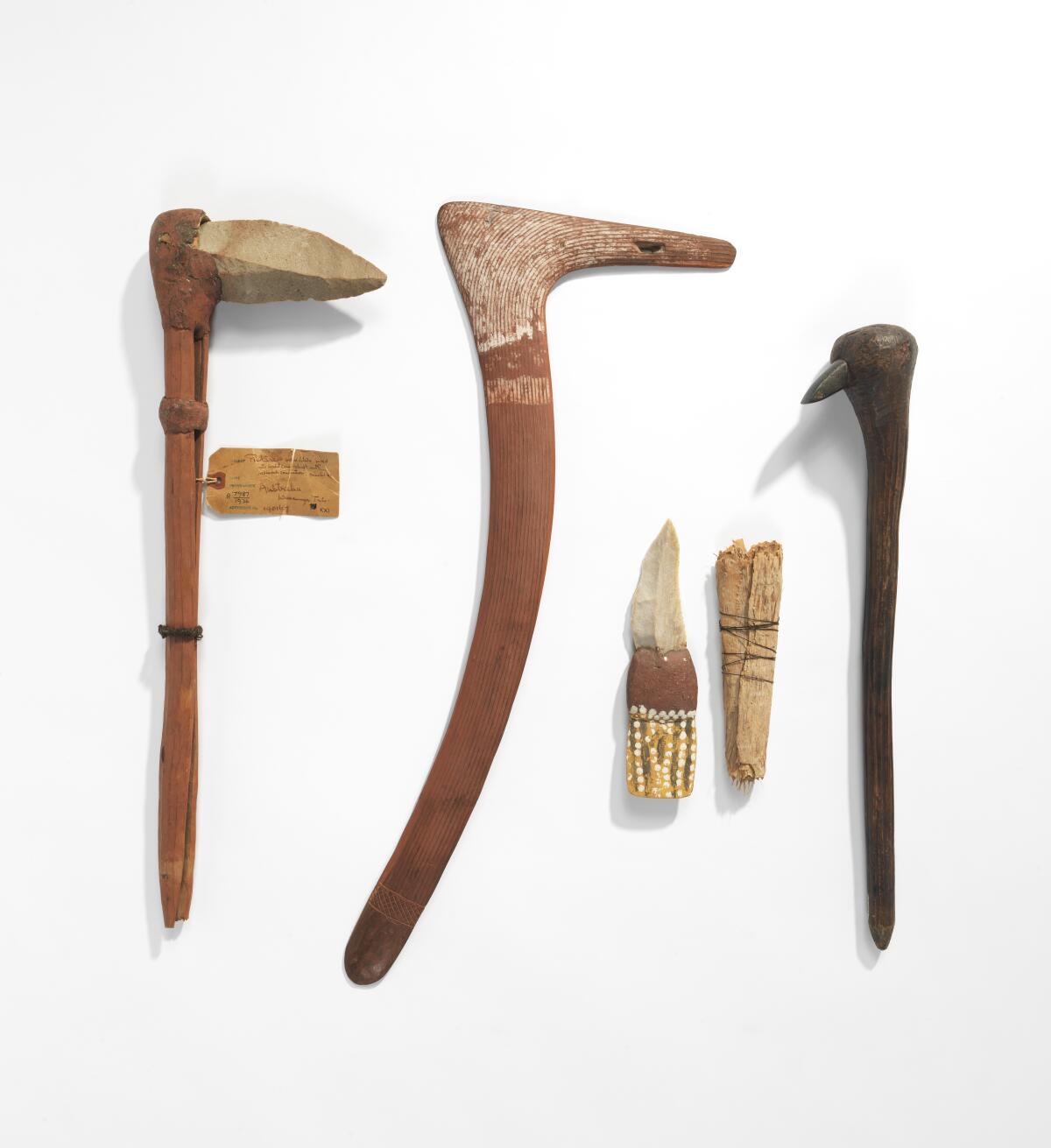 Wood and stone tools and a boomerang are among the artifacts being returned to the Warumungu community of Australia. 