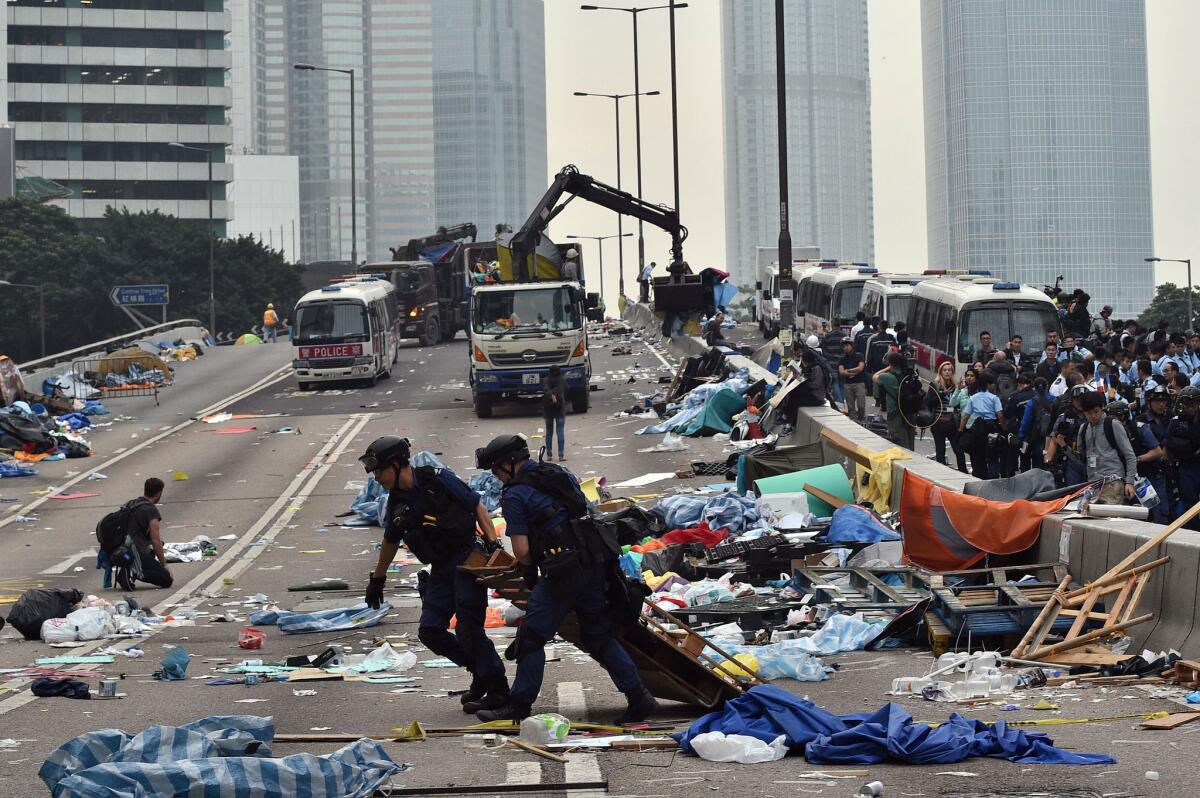 Hong Kong police dismantle what's left of the protest camp in the Admiralty district on Dec. 11.