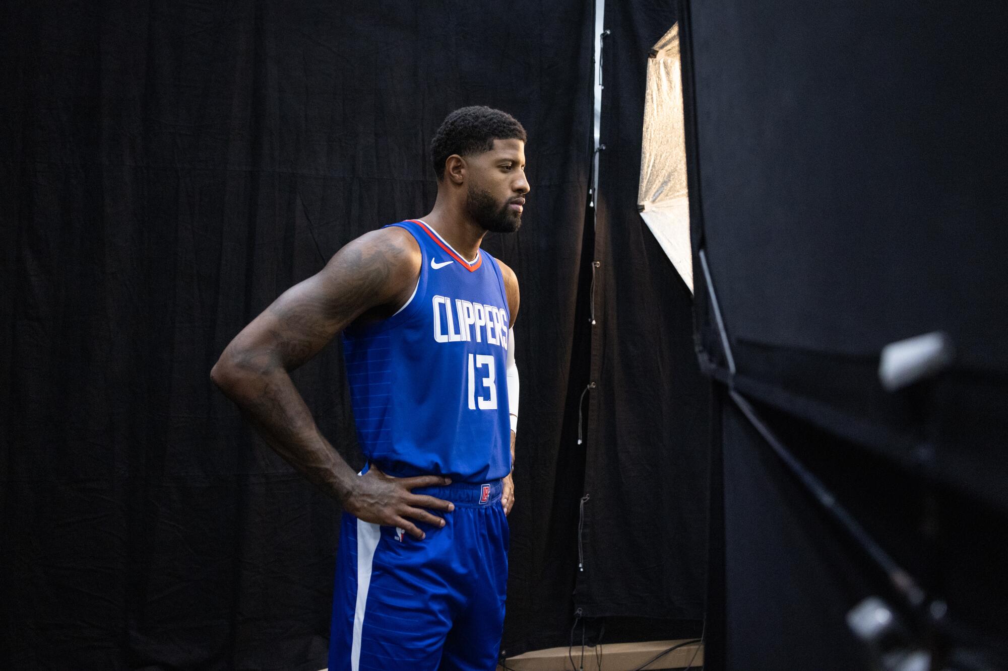 Clippers star Paul George poses for a portrait during media day.