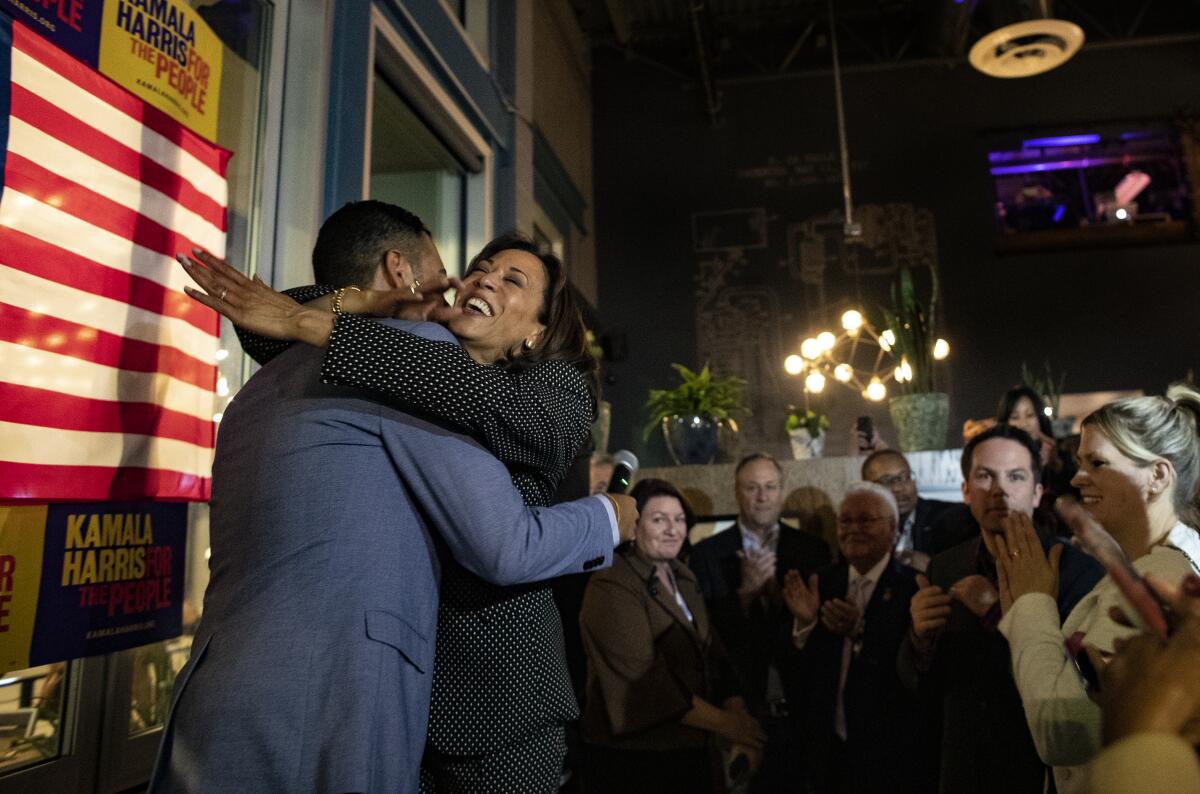 Sen. Kamala Harris hugs Long Beach Mayor Robert Garcia 