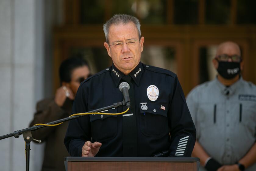 LOS ANGELES, CA - JUNE 30: Los Angeles Police Chief Michel Moore and Los Angeles County District Attorney George Gascon along with community leaders discuss community violence reduction efforts in Los Angeles on Wednesday, June 30, 2021 in Los Angeles, CA. (Jason Armond / Los Angeles Times)