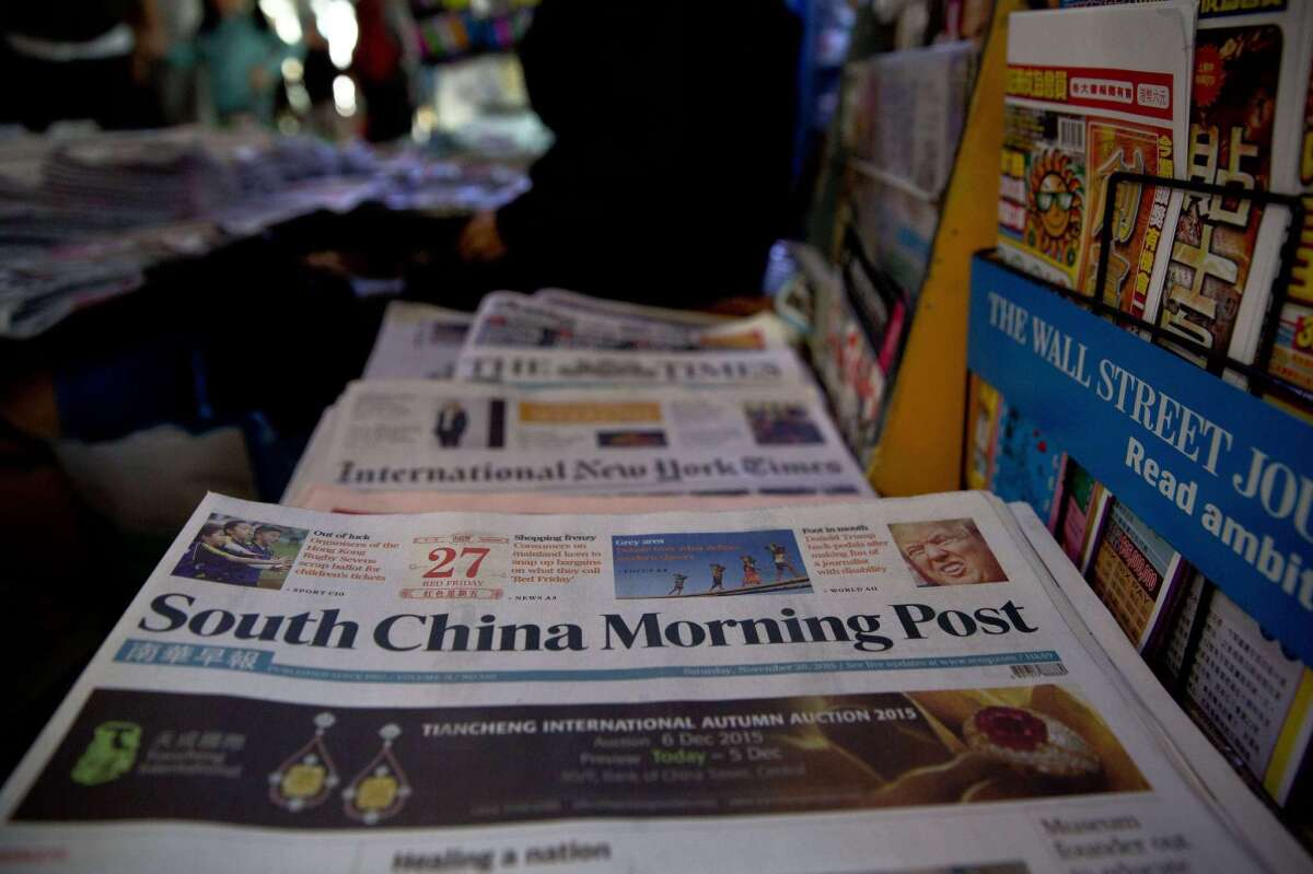 The South China Morning Post on sale at a newsstand in Hong Kong on Nov. 28. Chinese Internet giant Alibaba has announced it would buy the paper.