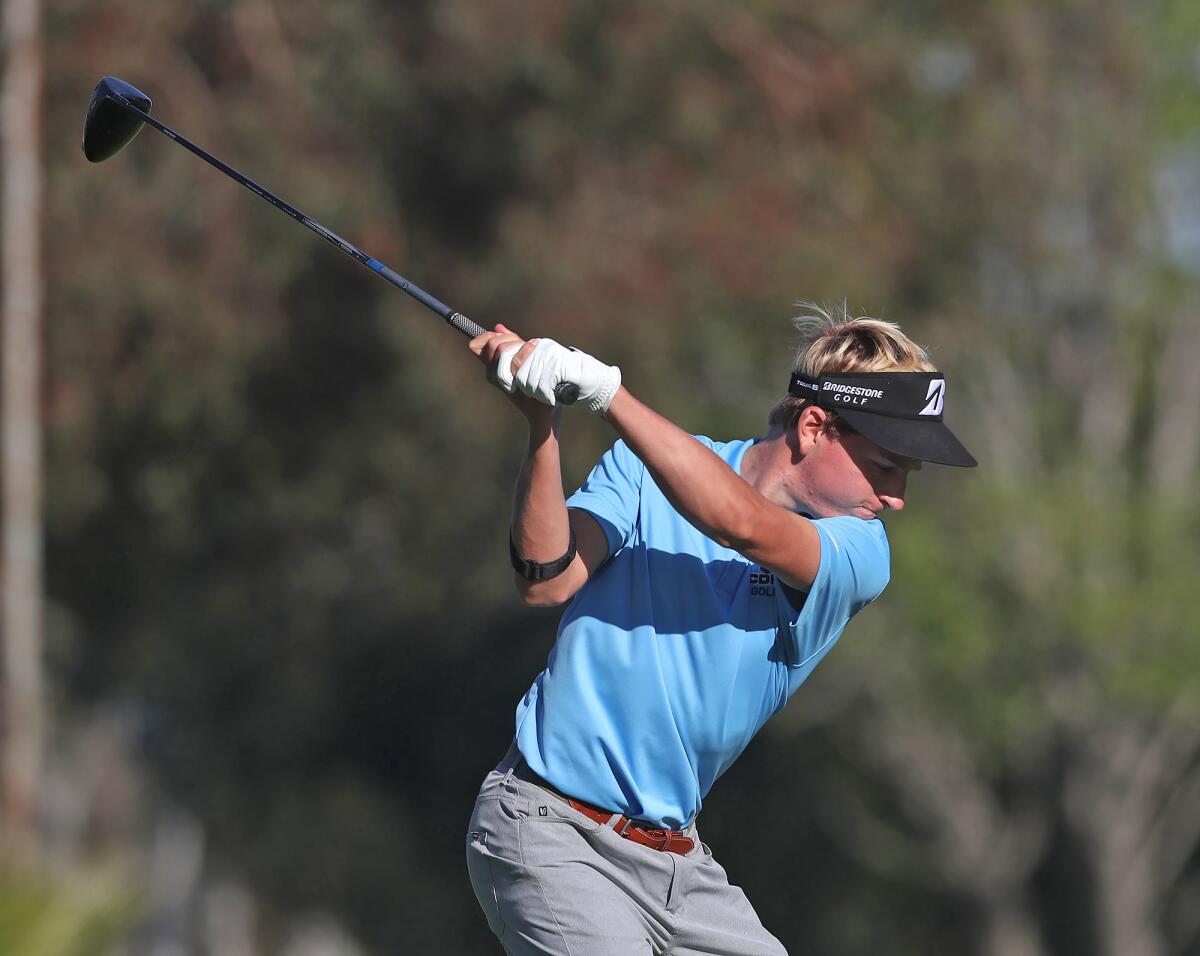 Charlie Olson of Corona del Mar drives the ball on the fifth hole on Wednesday at Costa Mesa Country Club.